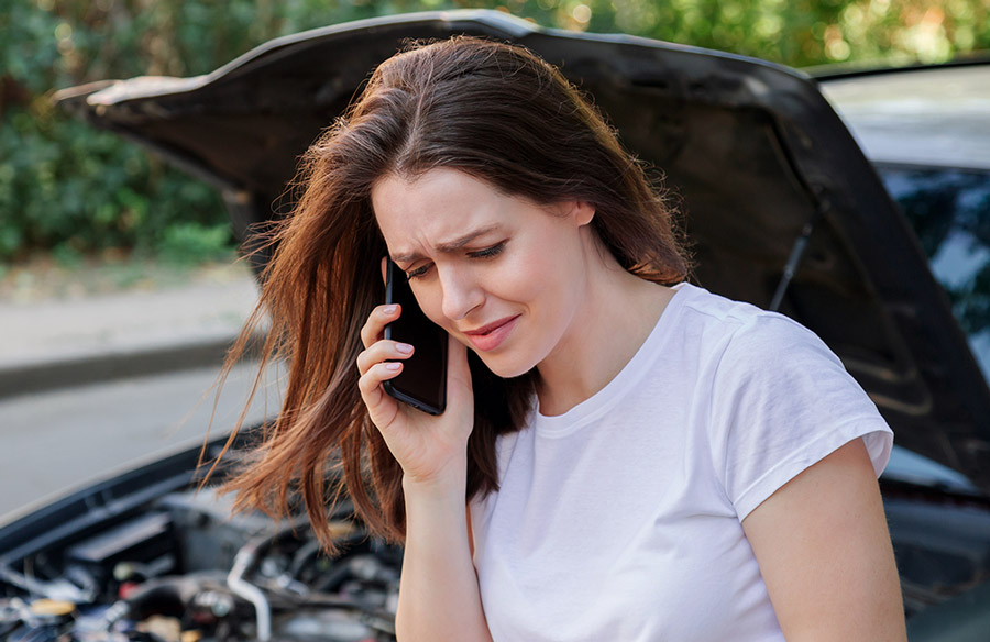 Woman on the phone with personal injury lawyer in toledo after a car accident. 