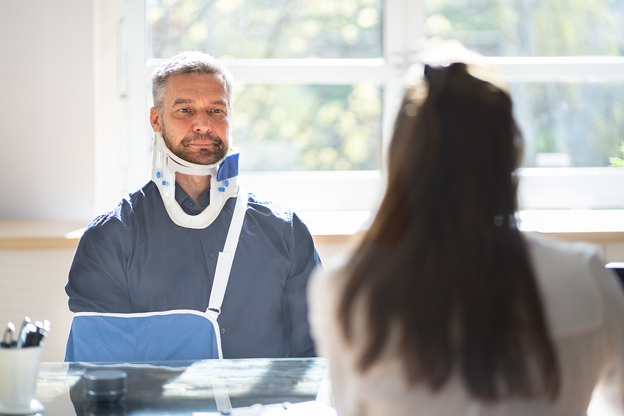 Motorcycle accident victim talking to a lawyer.