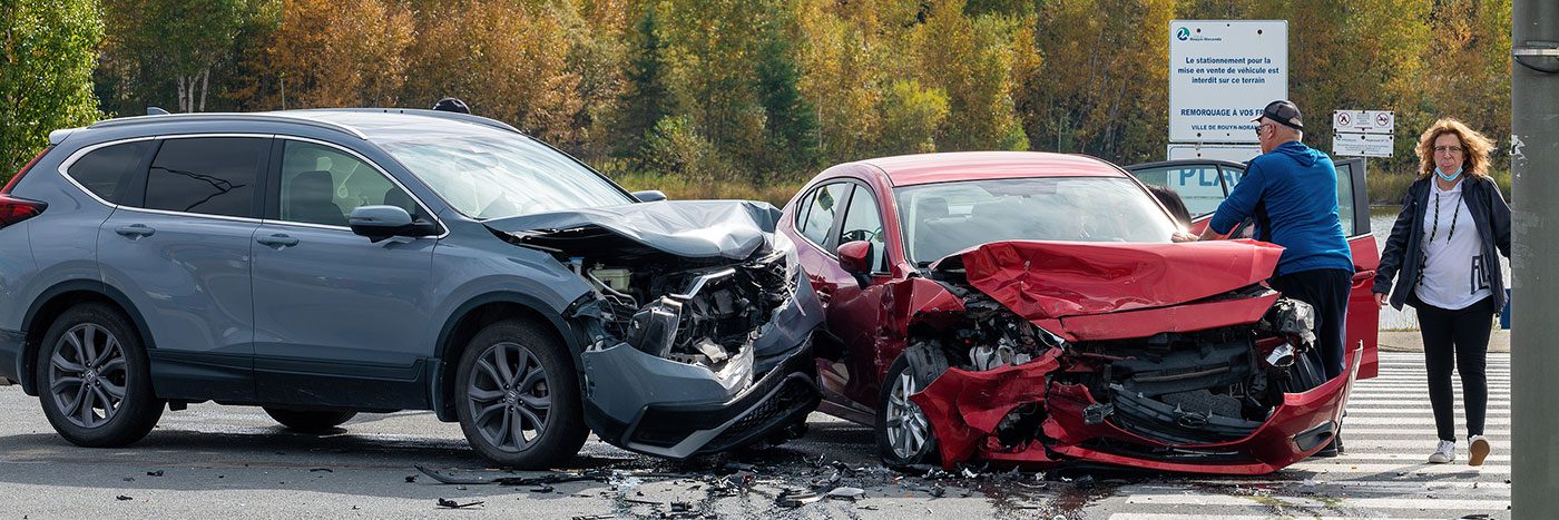 two car accident - both cars have significant damage to the front