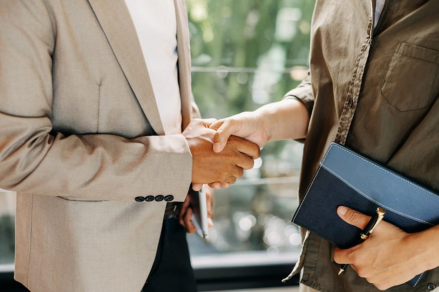 handshake between lawyer and a client