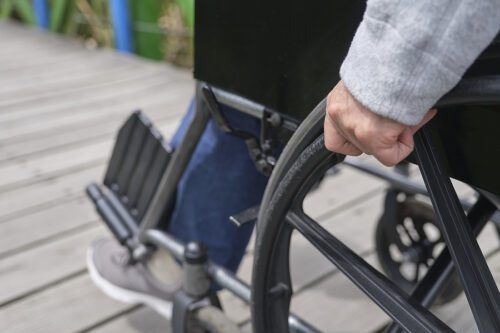 Person sitting in a wheel chair.