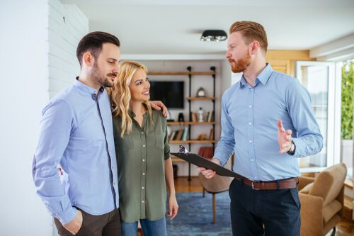 Young couple talking to a car accident lawyer.