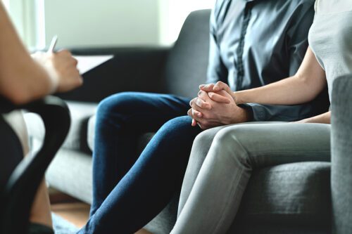 Married couple meeting with a lawyer after the death of a loved one.