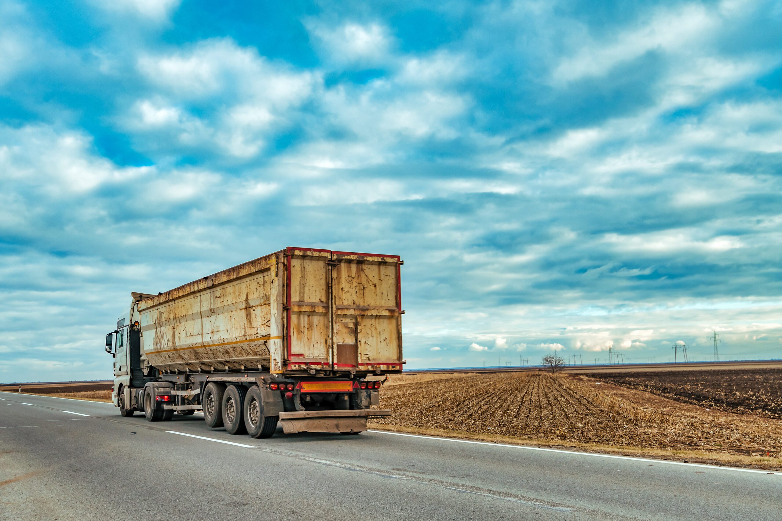 Truck on the road through countryside on cold autumn afternoon outside Edgerton Ohio