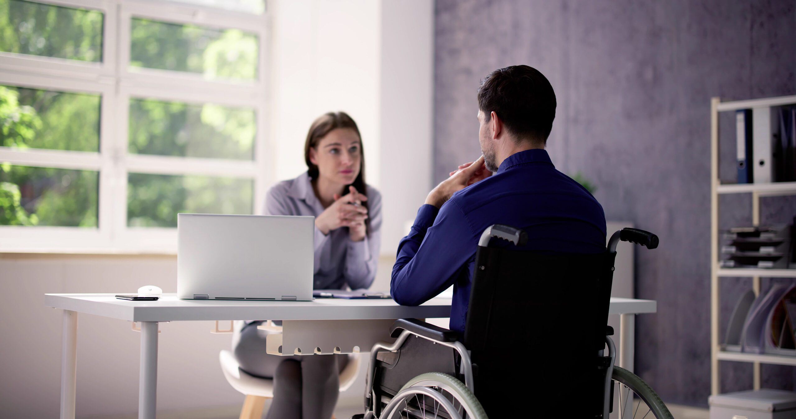 Worker consulting a lawyer about disability after a debilitating injury in Napoleon, Ohio