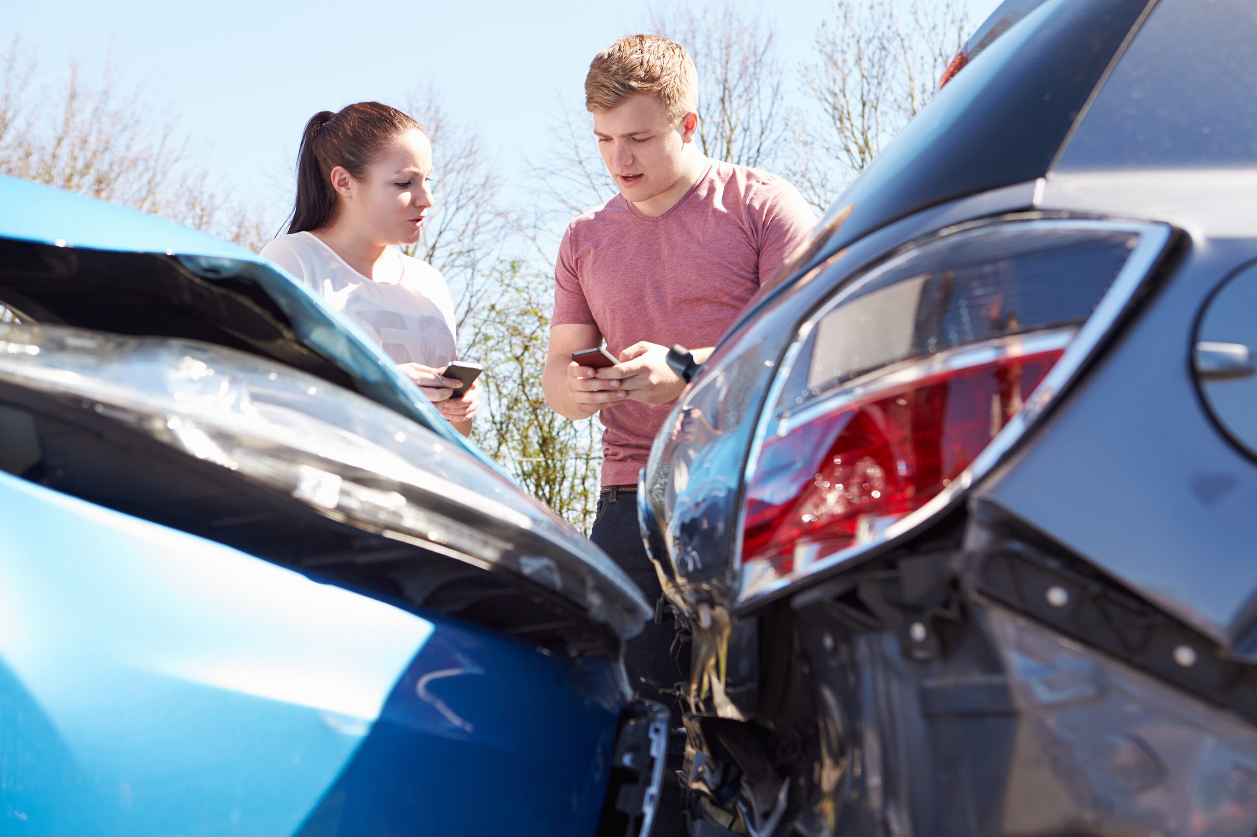 Two Drivers Inspecting Damage After Traffic Accident in Napoleon, Ohio